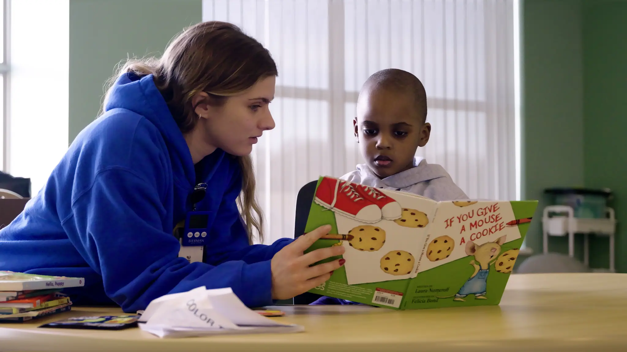 Bierman therapist supporting a child during an ABA therapy activity
