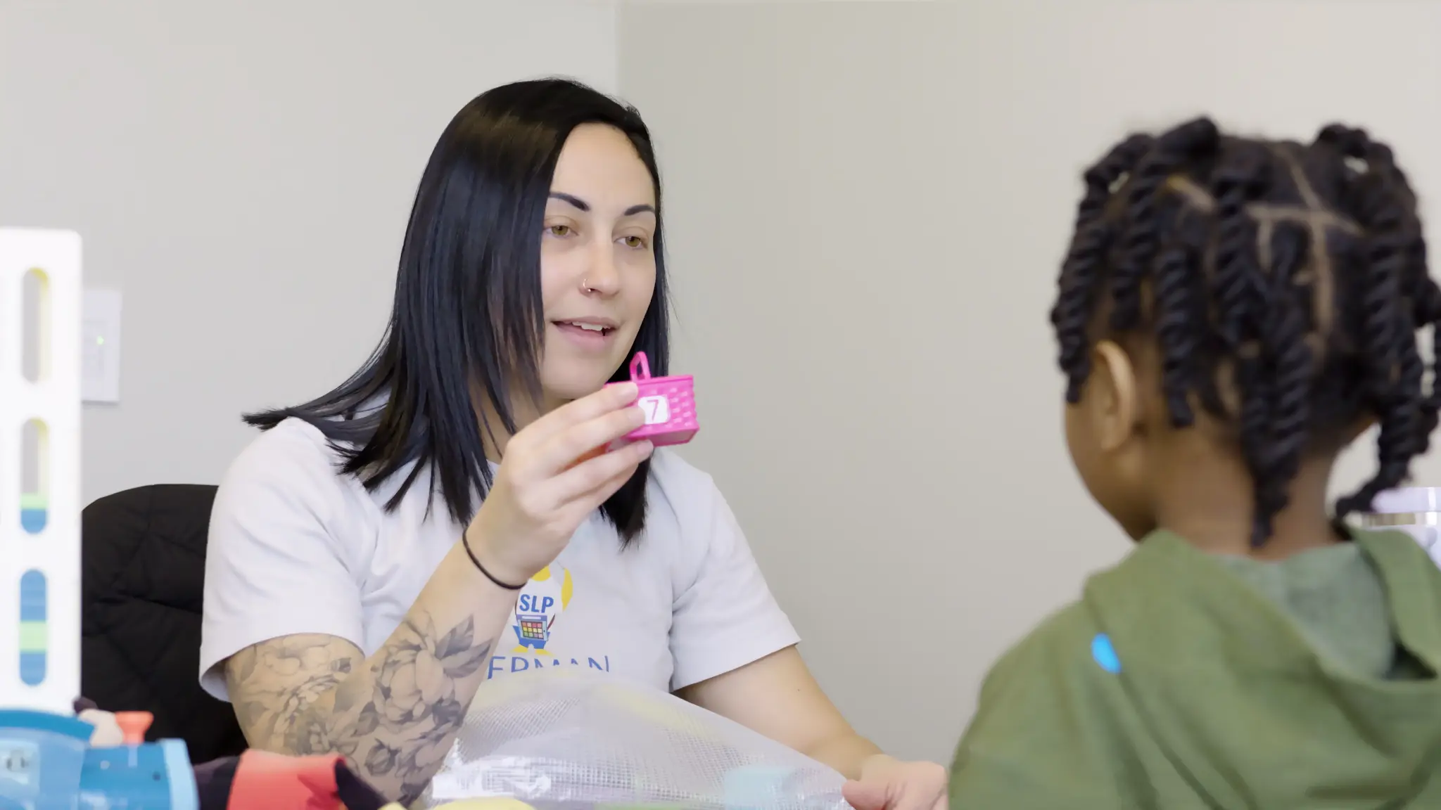Bierman speech-language pathologist working with a child during a communication activity